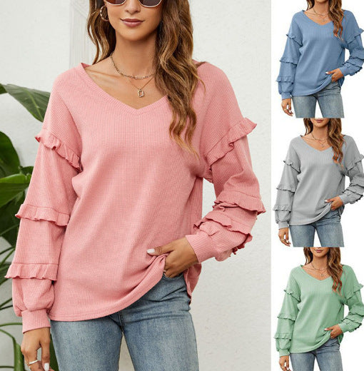 Dame V-hals pullover med rufflelementer og løs pasform Stilla