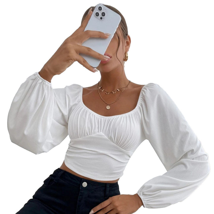 Kvindernes cropped top med stilfuldt pufærme-design og tætsiddende silhuet Stilla