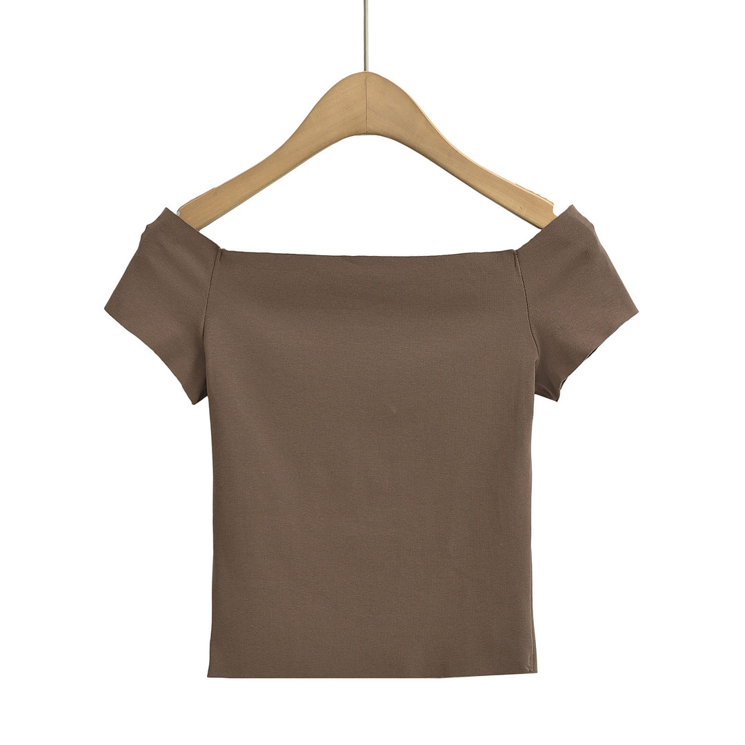 Dame top med smart off-shoulder-design og delikate puffærmer Stilla