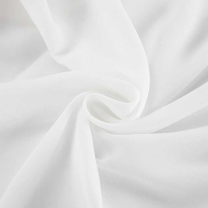 Damebluse med volumniøse flæser og elegante ærmer Stilla