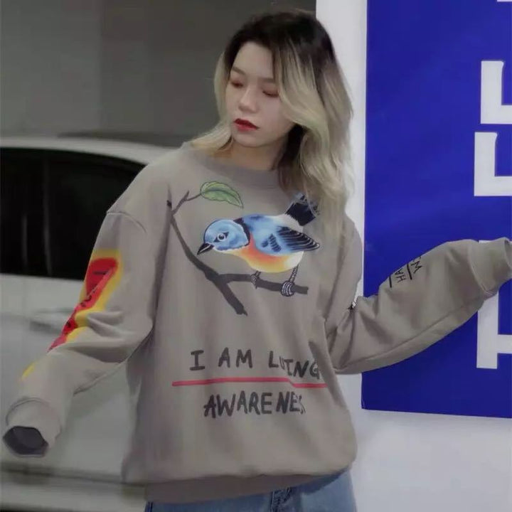 Dame sweatshirts med unikt fuglemotiv og inspirerende grafikker Stilla