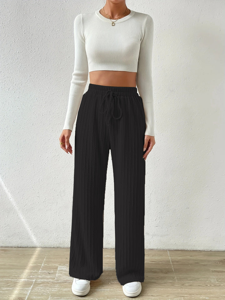 Dame afslappet lounge-sæt med strækbart crop-top og bløde palazzo-bukser Stilla