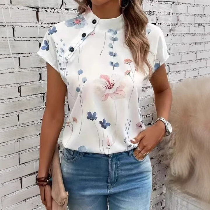 Damebluse med florale accenter og knapdetaljer Stilla