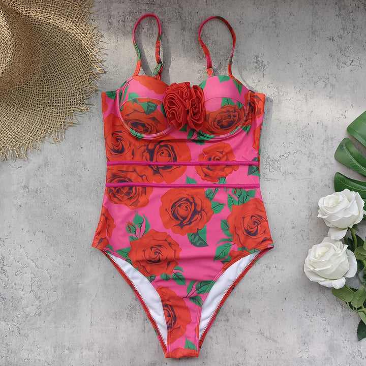 Dame badedragt med blomstret design og raffinerede stropdetaljer Stilla