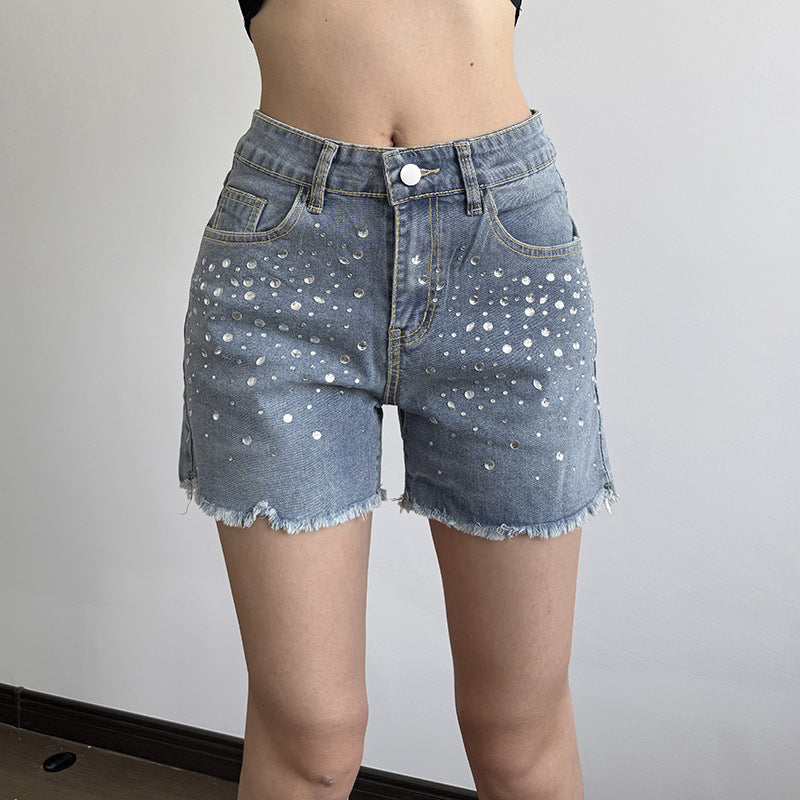 Dame jeans shorts med glitrende applikationer og frynset kant Skovae