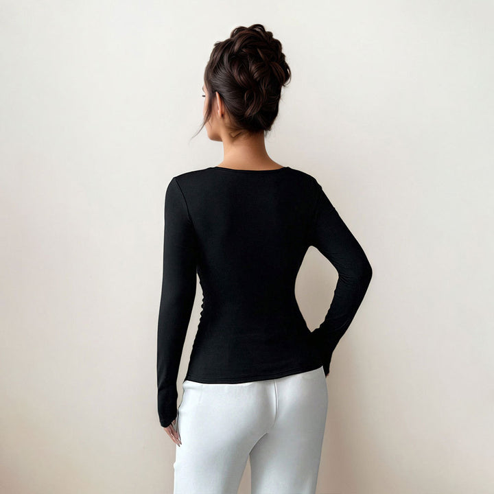 Kvindernes figursyede langærmede top med elegant twistsdetail Stilla