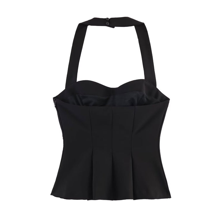 Dame halterneck-top med elegant taljesnit og fine plisseedetaljer Skovae