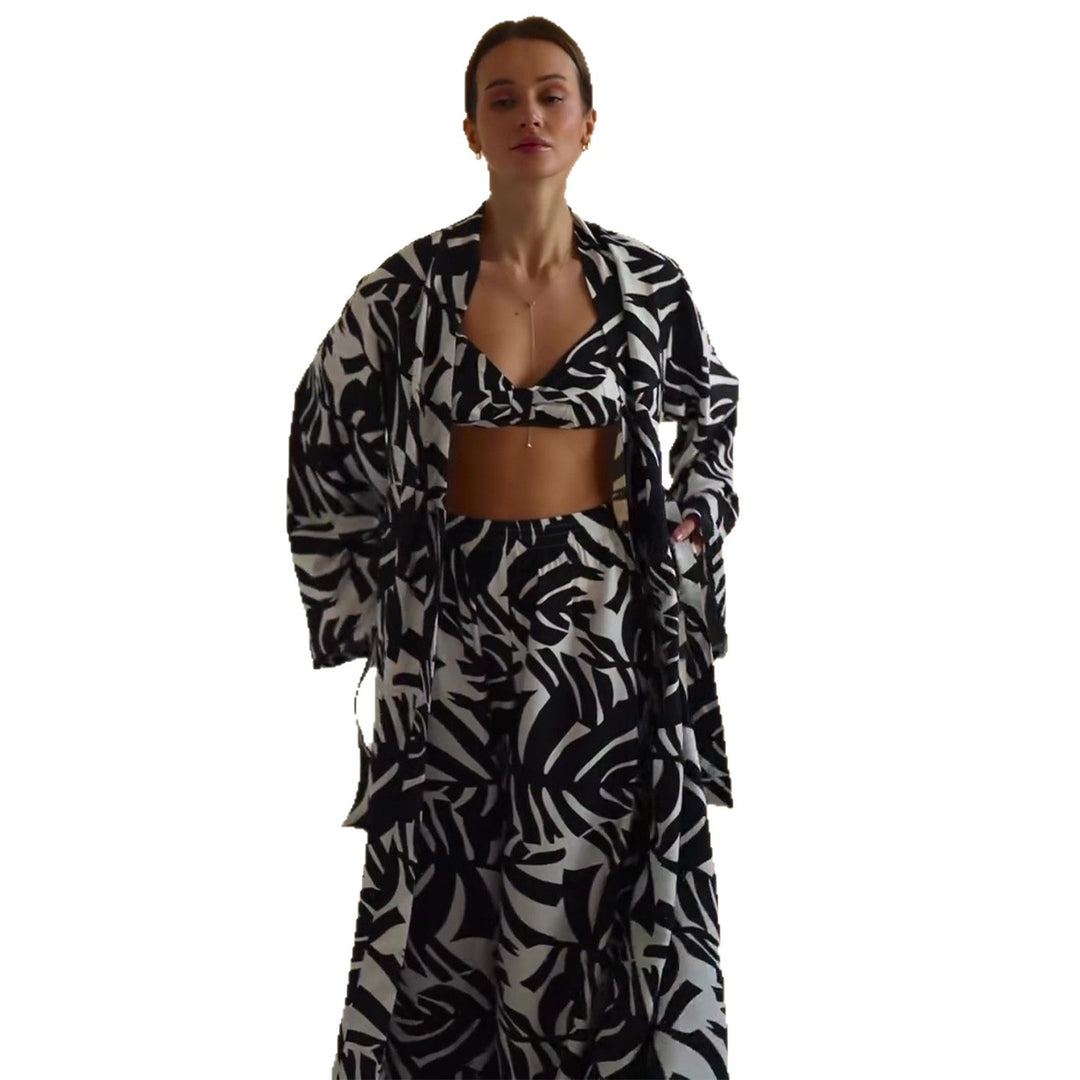 Kvinders strandoutfit med trendy blomsterprint Skovae