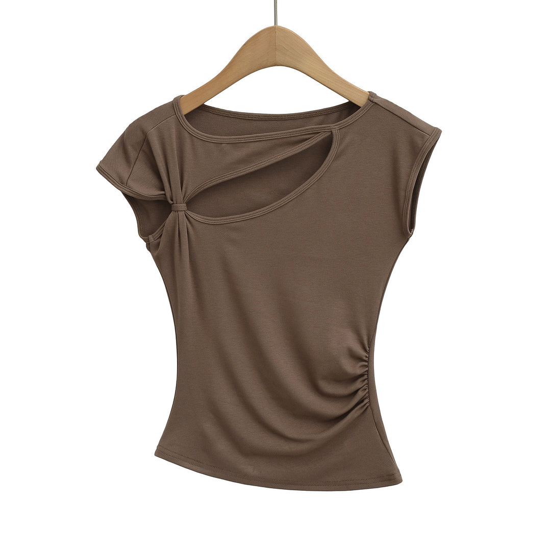 Dame sportslig top med asymmetrisk snit og modige cut-out-detaljer Stilla