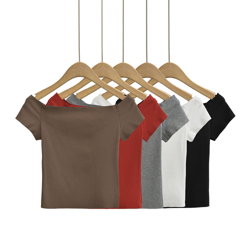 Dame top med smart off-shoulder-design og delikate puffærmer Stilla