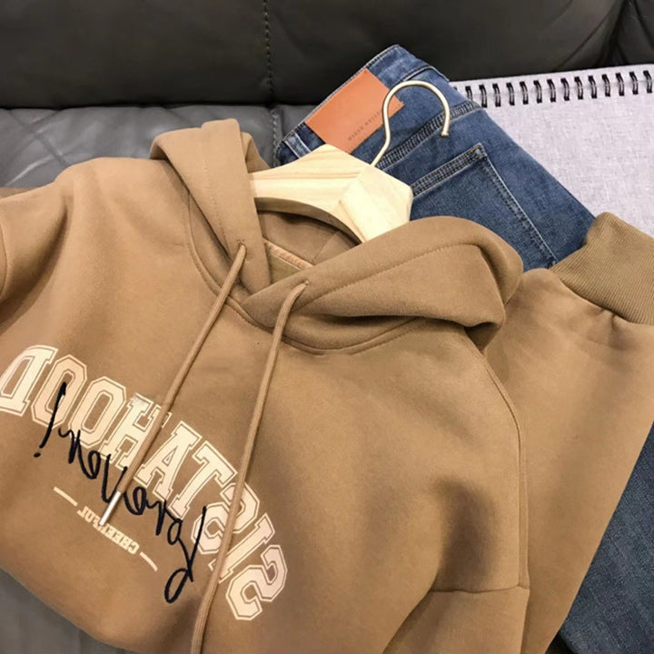 Kvinders hoodie med kreativ tekst og afslappet oversized pasform