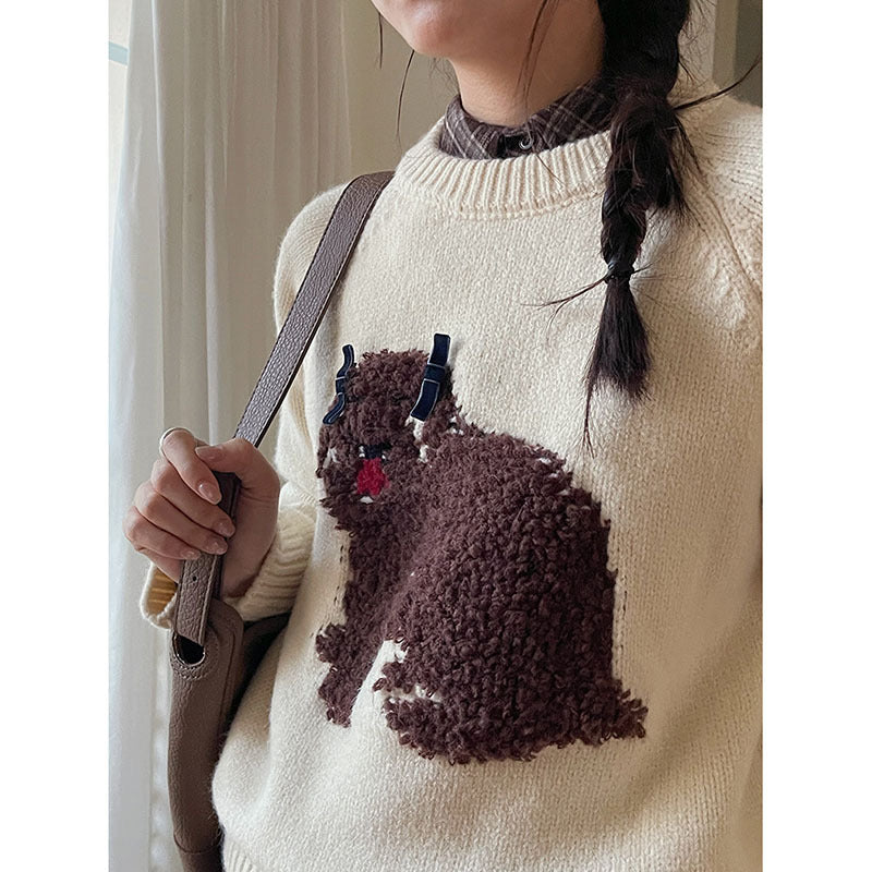 Dame strikket pullover med legesygt hundemotiv og elegante ruffleafslutninger Stilla
