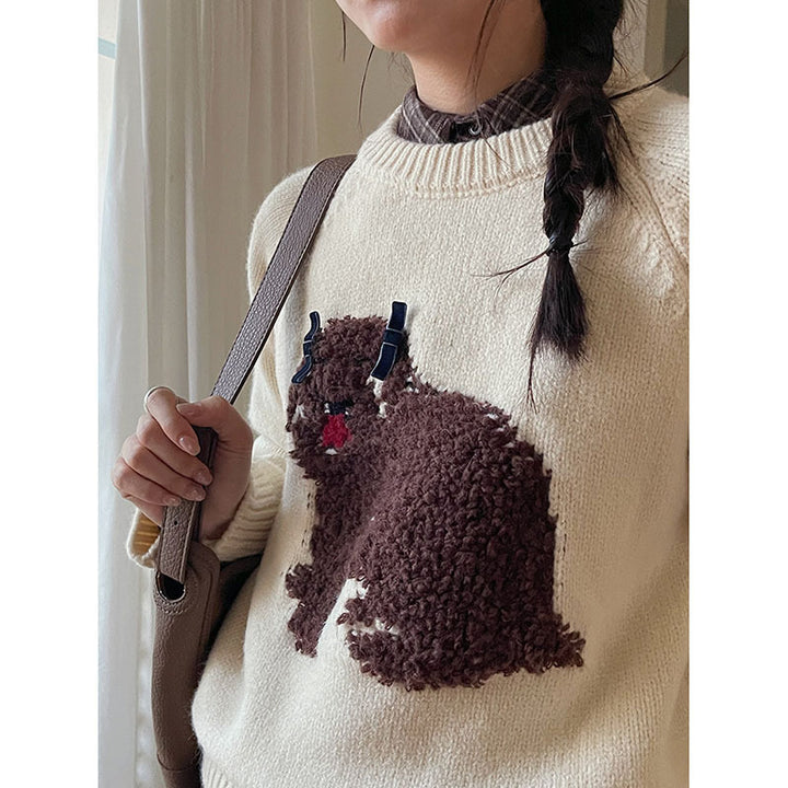 Dame strikket pullover med legesygt hundemotiv og elegante ruffleafslutninger Stilla