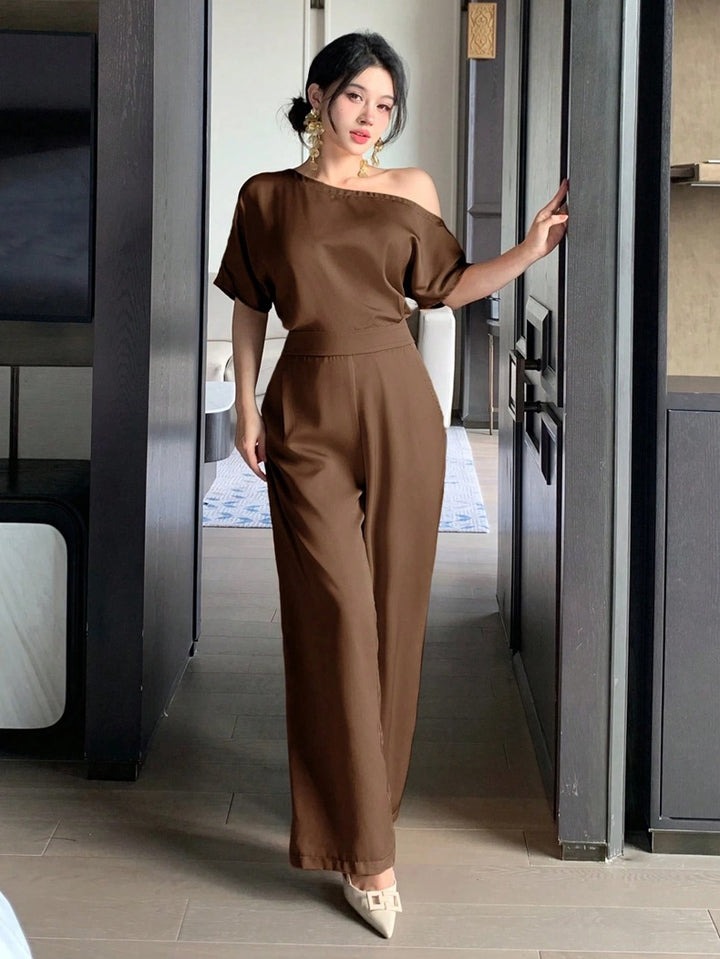 Dame Én skulder jumpsuit med bred ben og elegant snit Skovae