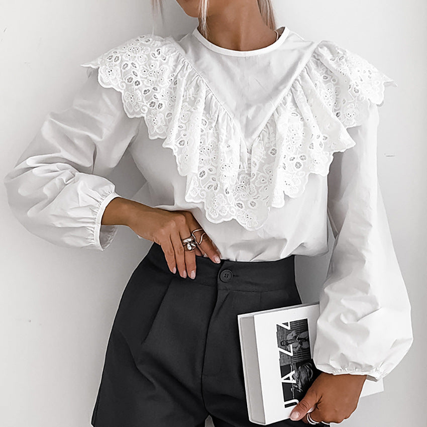 Damebluse med elegant spids og voluminøse ærmer Stilla