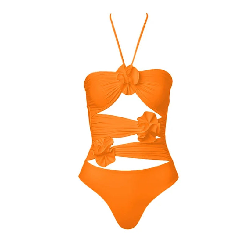 Dame svømmedragt med blomstret design og raffineret cut-out-look Skovae