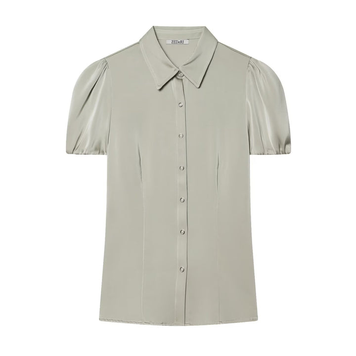 Damebluse med korte pufærmer og elegant knapliste Skovae