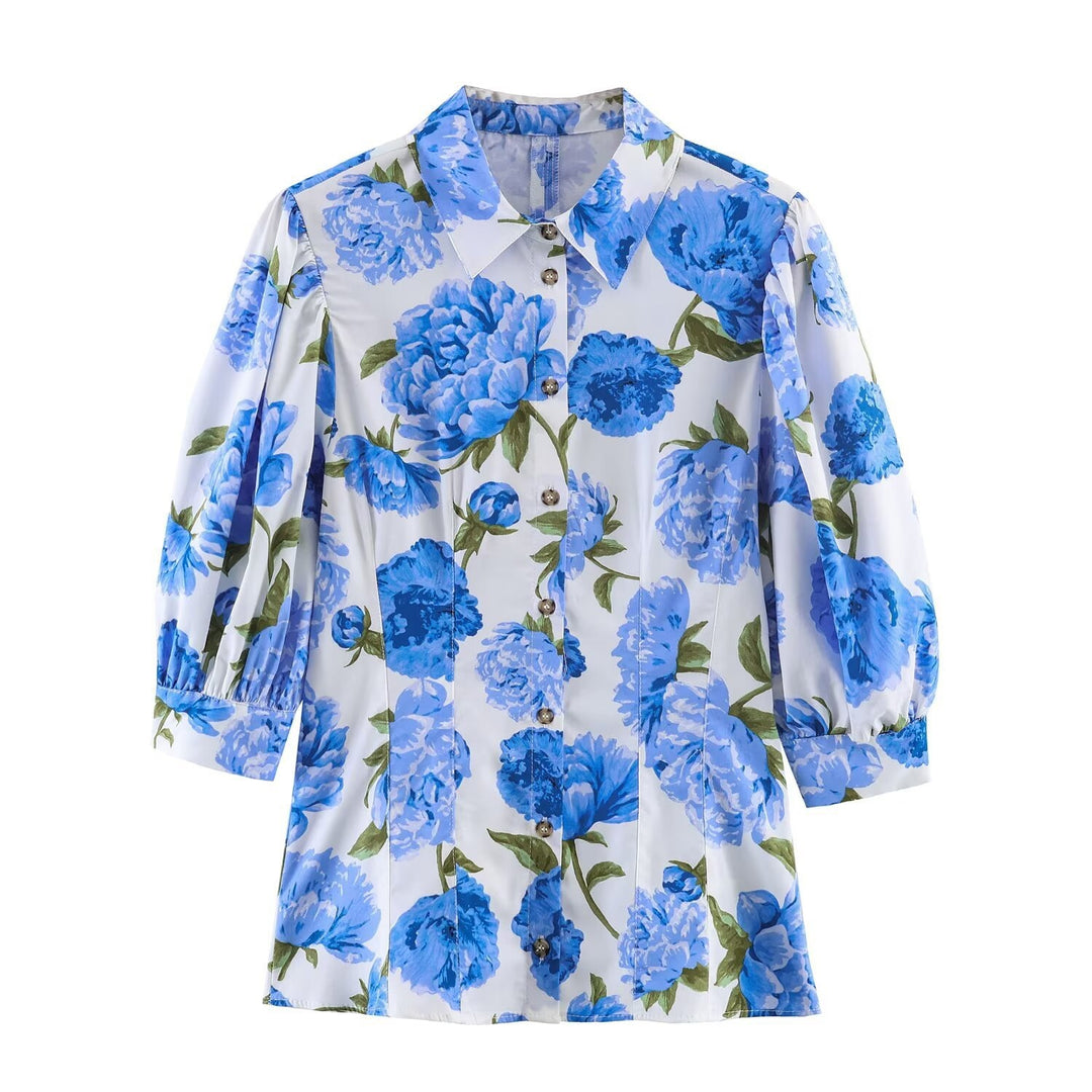 Damebluse med blomstermønster og elegante pufærmer Skovae