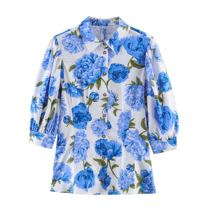 Damebluse med blomstermønster og elegante pufærmer Skovae