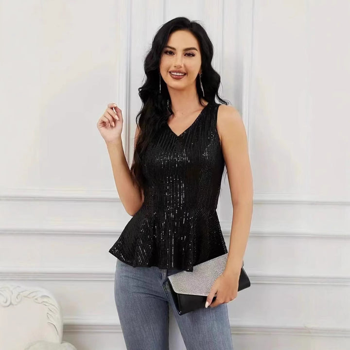 Dame Peplum top med skinnende pailletdetaljer og elegant snit Stilla
