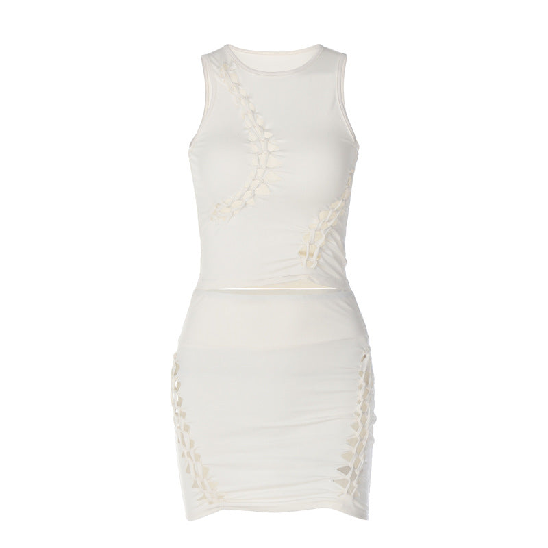 Dame Sæt bestående af sporty top og figursyet miniskørt med trendy cut-out-detaljer Stilla