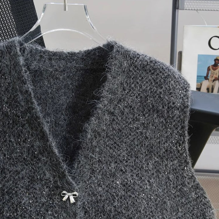 Dame strikket vest med glitrende accenter og dekorative knapper Stilla