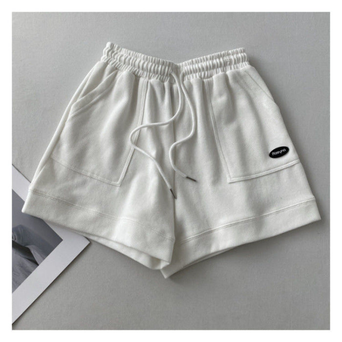 Kvindernes afslappede joggingshorts med elastisk talje og praktiske sidelommer