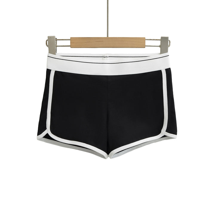 Dame sporty korte shorts med elastisk talje og kontrasterende piping Stilla