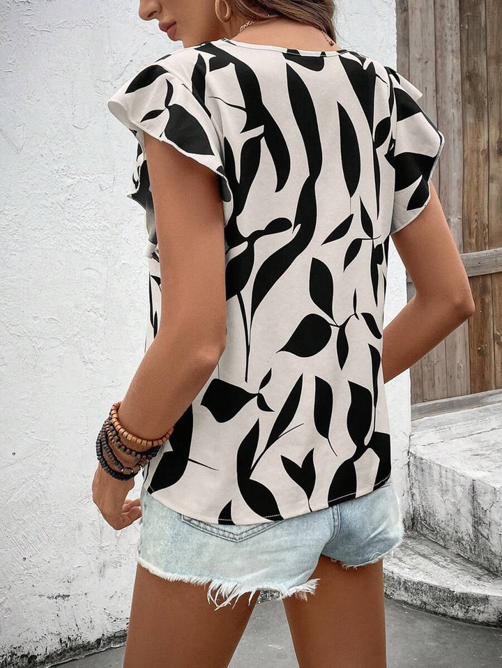 Damebluse med flæseærmer og blomsterdesign Stilla