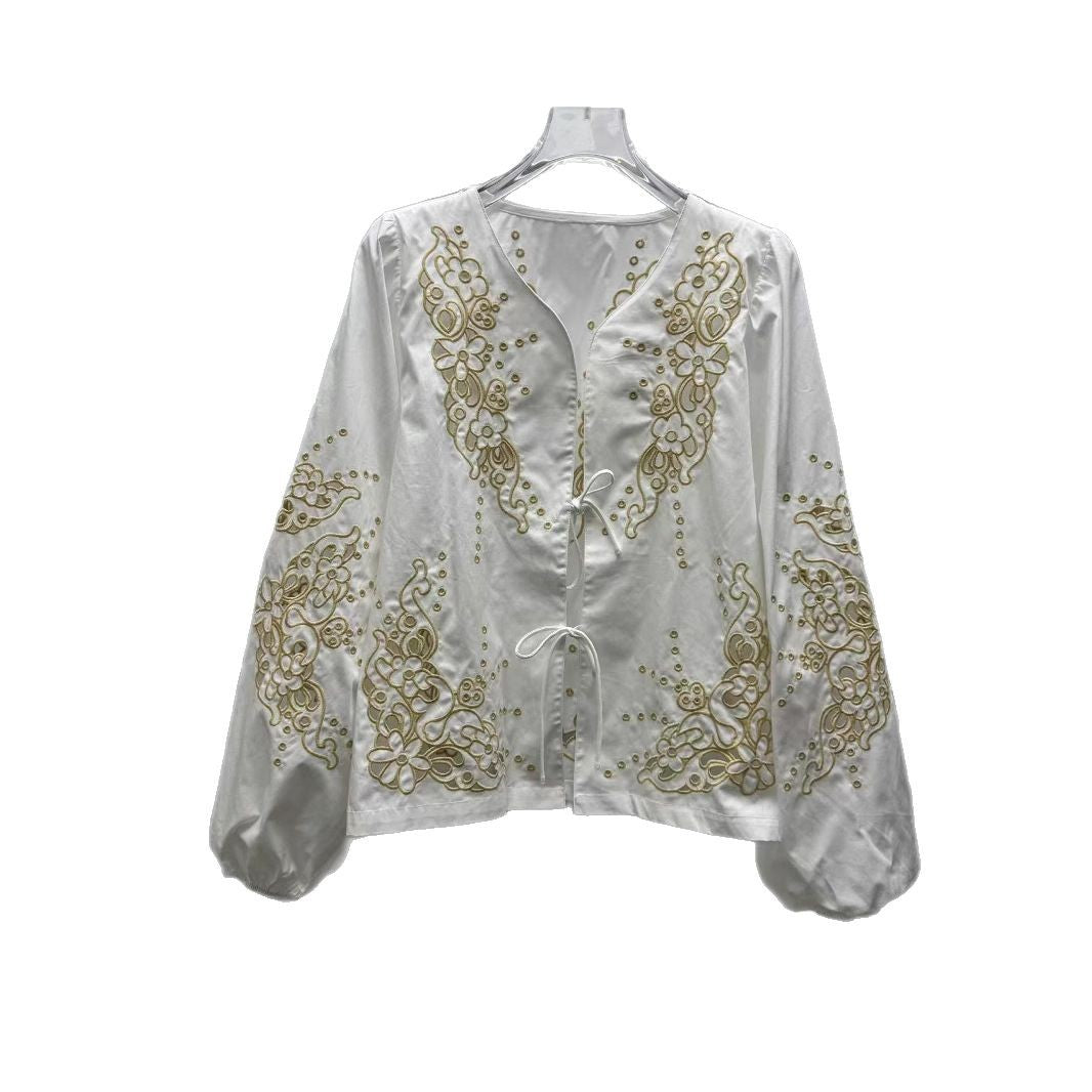 Damebluse med florale hulbroderier og afslappet skæring Stilla
