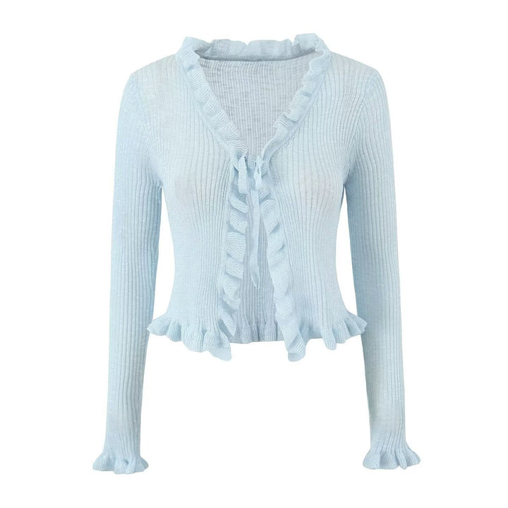 Dame ribstrikjakke med fine ruffles detaljer og afslappet snit Stilla