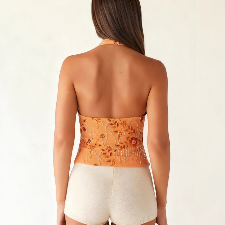 Kvindernes halterneck-toppe med blomstret design og glitrende applikationer