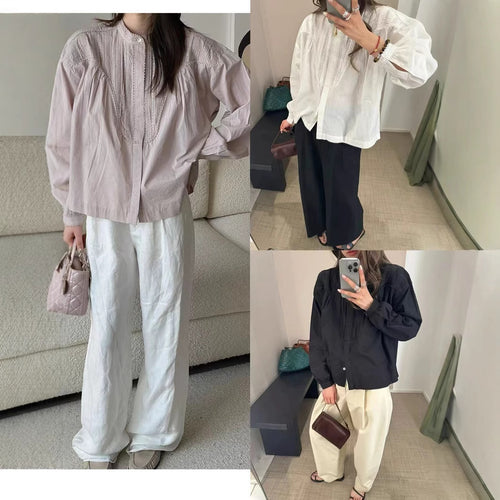 Damebluse med kunstneriske detaljer og fin knapstolpe Stilla