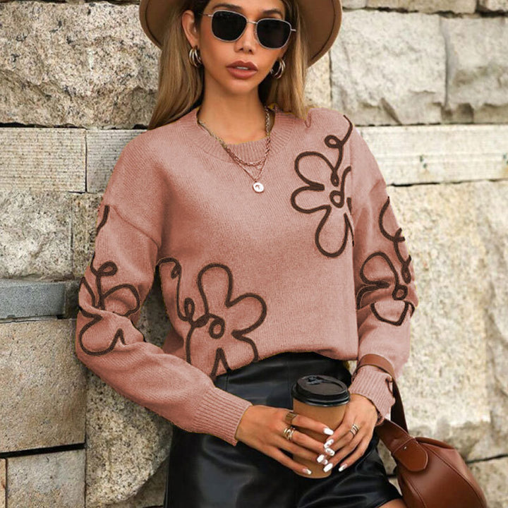 Kvindernes fashionable trøje med blomsterapplikationer Stilla