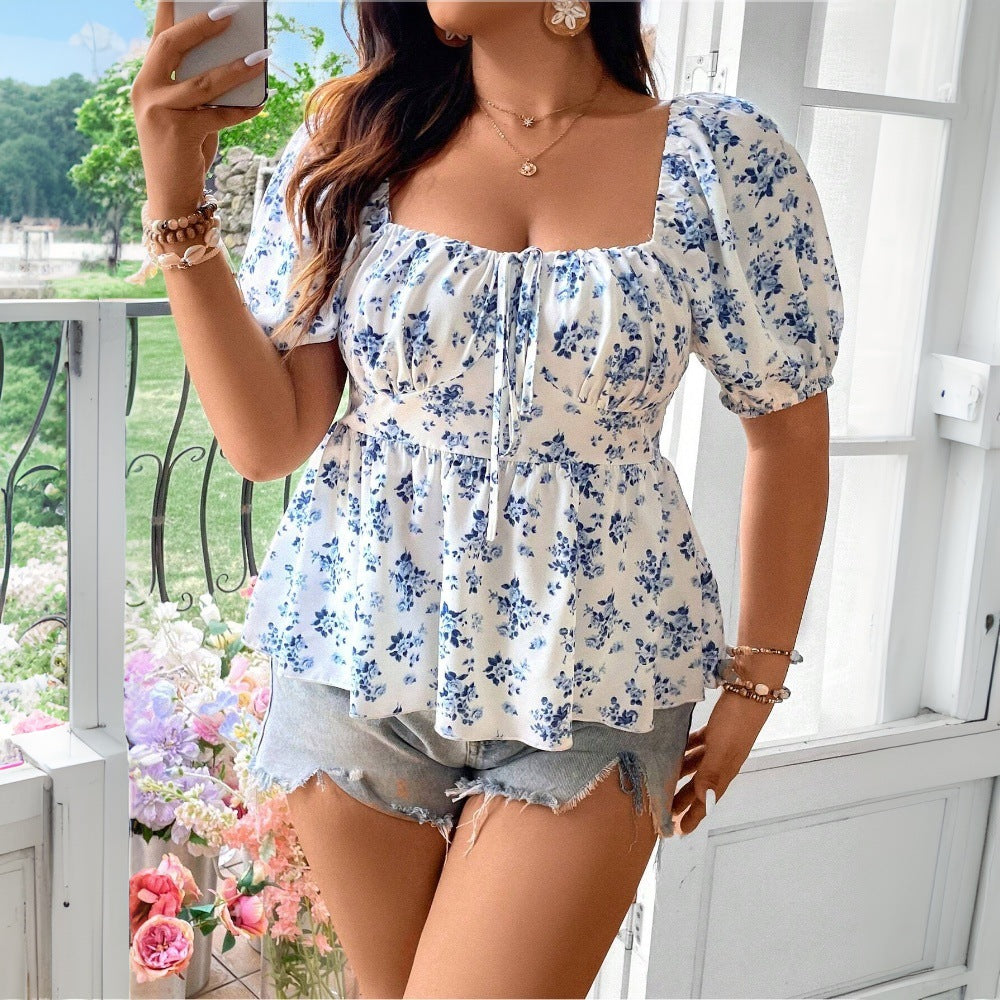 Damebluse med puffærmer og blomster mønster Stilla