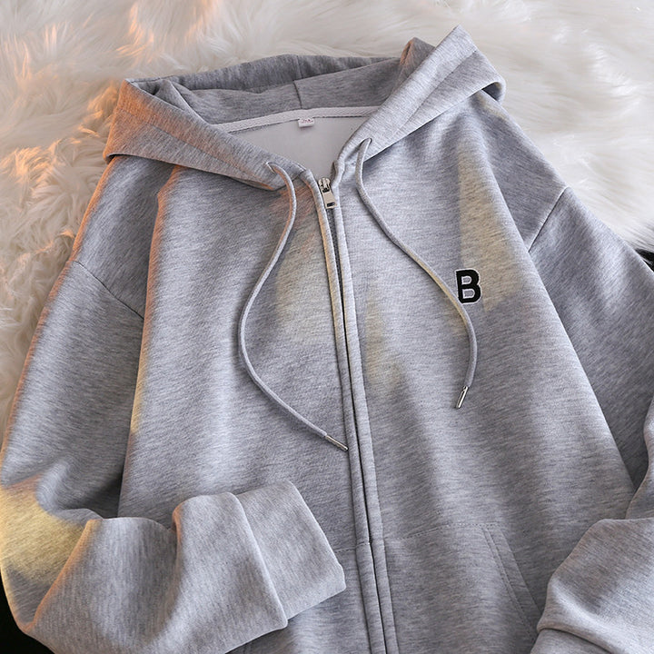 Femme Cozy Zip-Up Hoodie med elegant broderet detalje Stilla