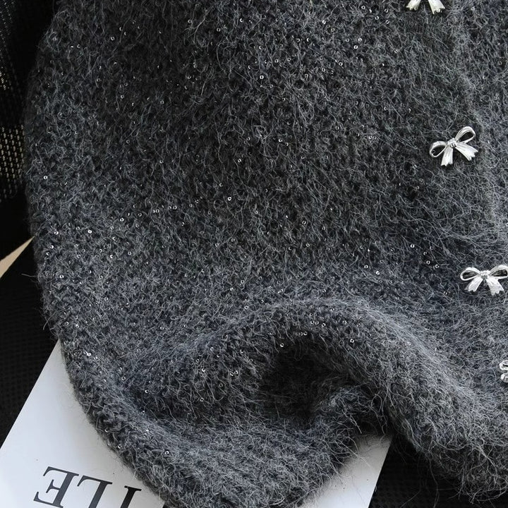 Dame strikket vest med glitrende accenter og dekorative knapper Stilla
