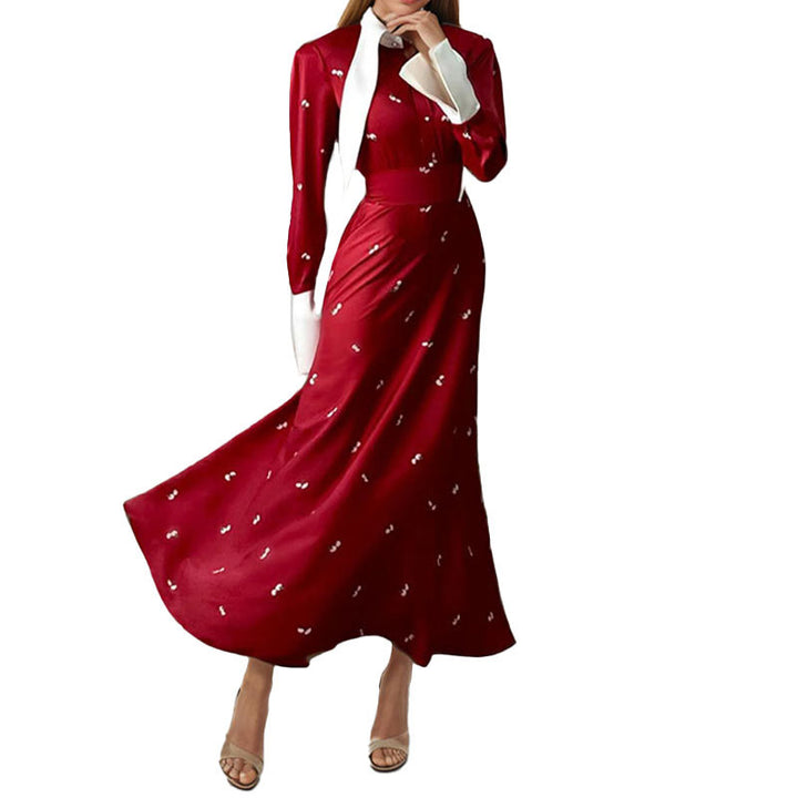 Kvinders elegante maxikjole med kunstnerisk drapering og lange ærmer Stilla