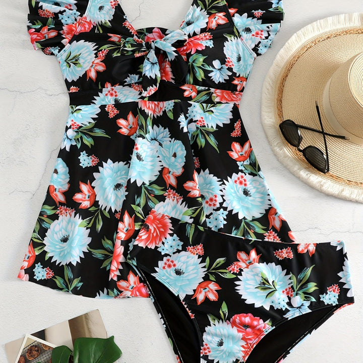Dame én-delt badedragt med ruffledetails og blomstret design Skovae