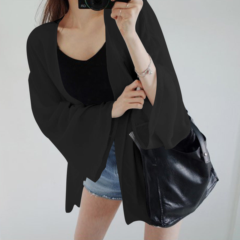 Damer elegant kimono jakke med en løs pasform og detaljeret designede ærmer