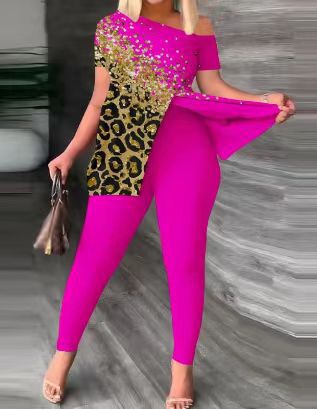 Dame figursyet jumpsuit med off-shoulder design og glamourøse accenter Skovae