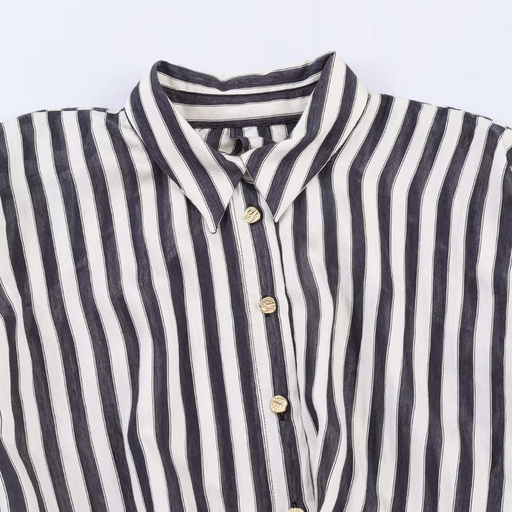 Dame jumpsuit med elegant stribemønster og dekorativt bælte Skovae