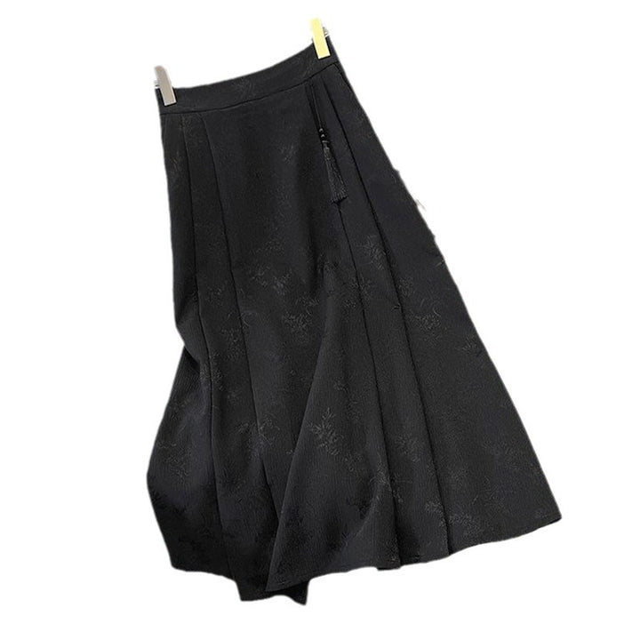 Kvinders elegante midi-nederdel med tekstureret stof og svajende snit