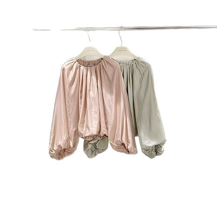 Dame elegant bluse med puffærmer og skinnende finish Stilla