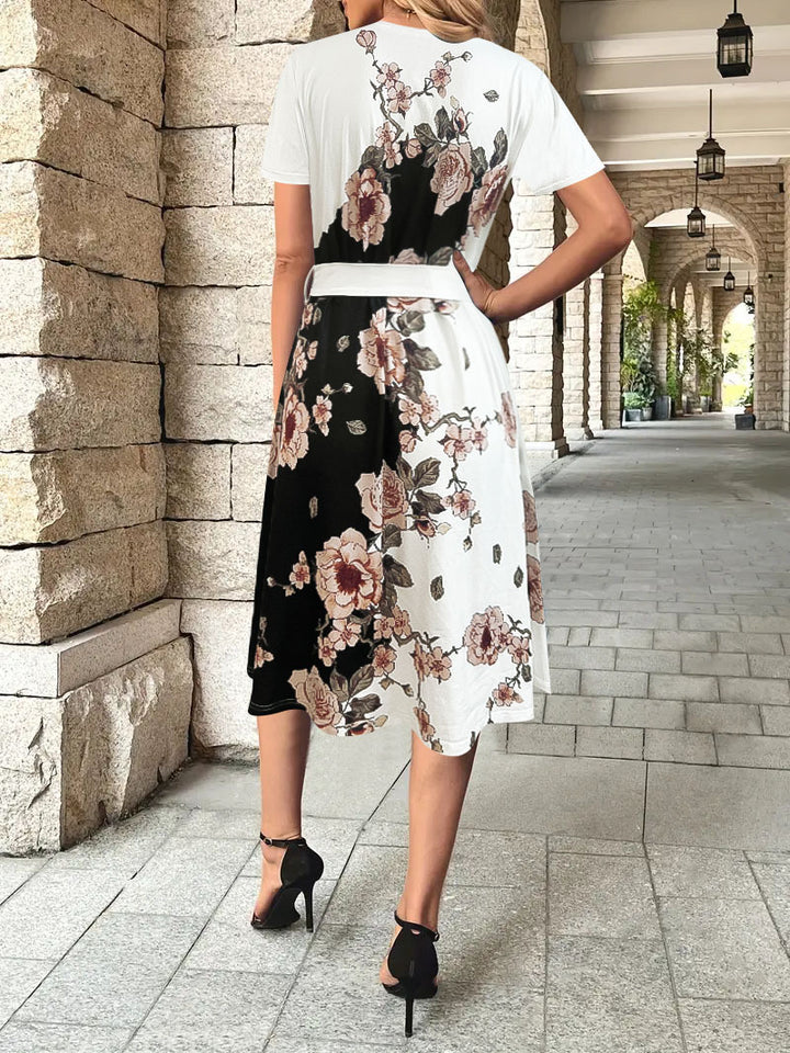 Damekjole med floral design og taljerbart bælte Stilla