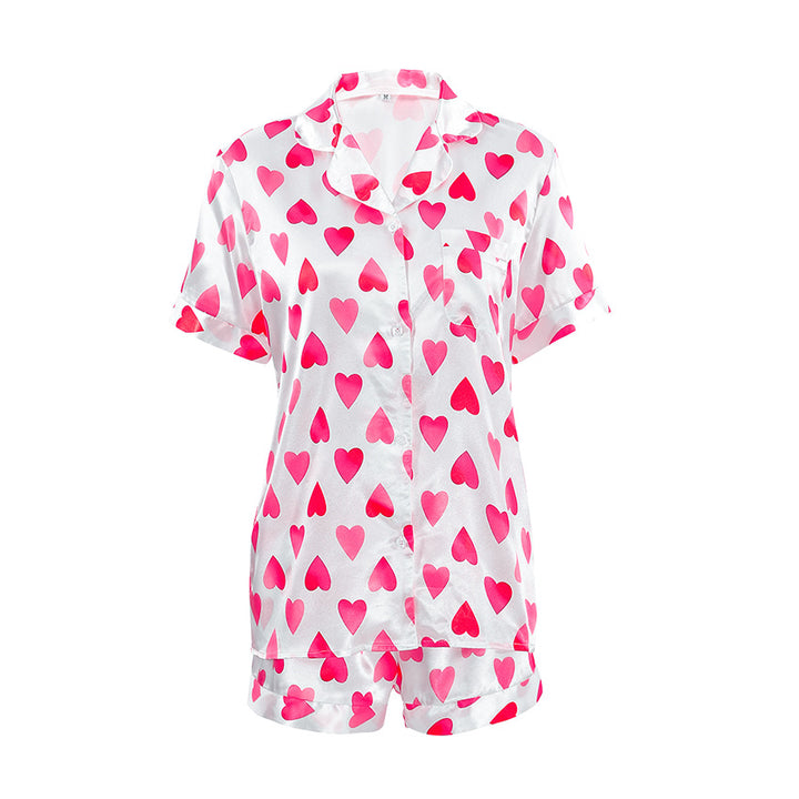 Dame pyjamasæt med hjerteformet motiv og elegant satinfølelse Stilla