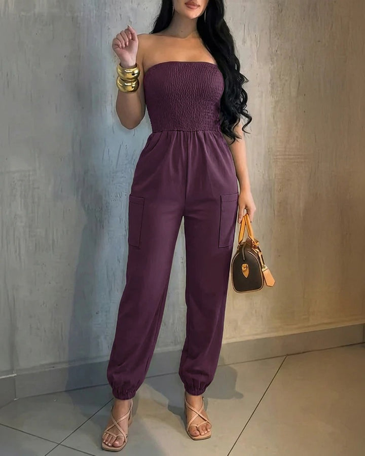 Damer Behagelig Jumpsuit med skulderfri design og praktiske lommer Skovae