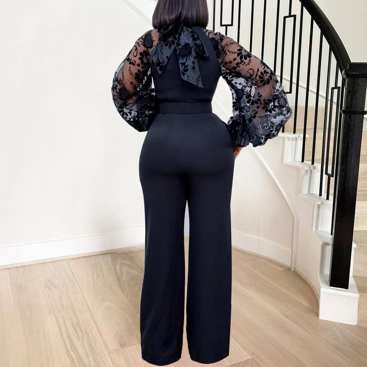 Dame elegant jumpsuit med voluminøse tylærmer og figursyet snit Stilla