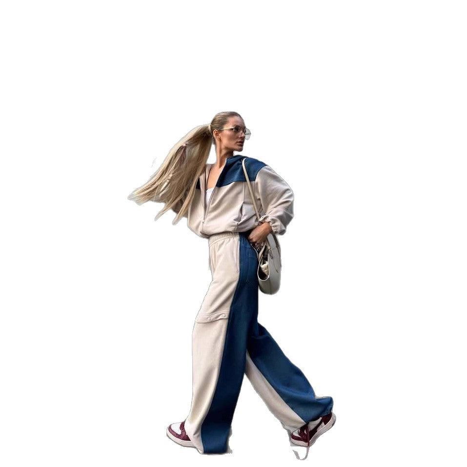 Kvinders fashionable casual outfit med sporty jakke og kreativt udskårne bukser Skovae