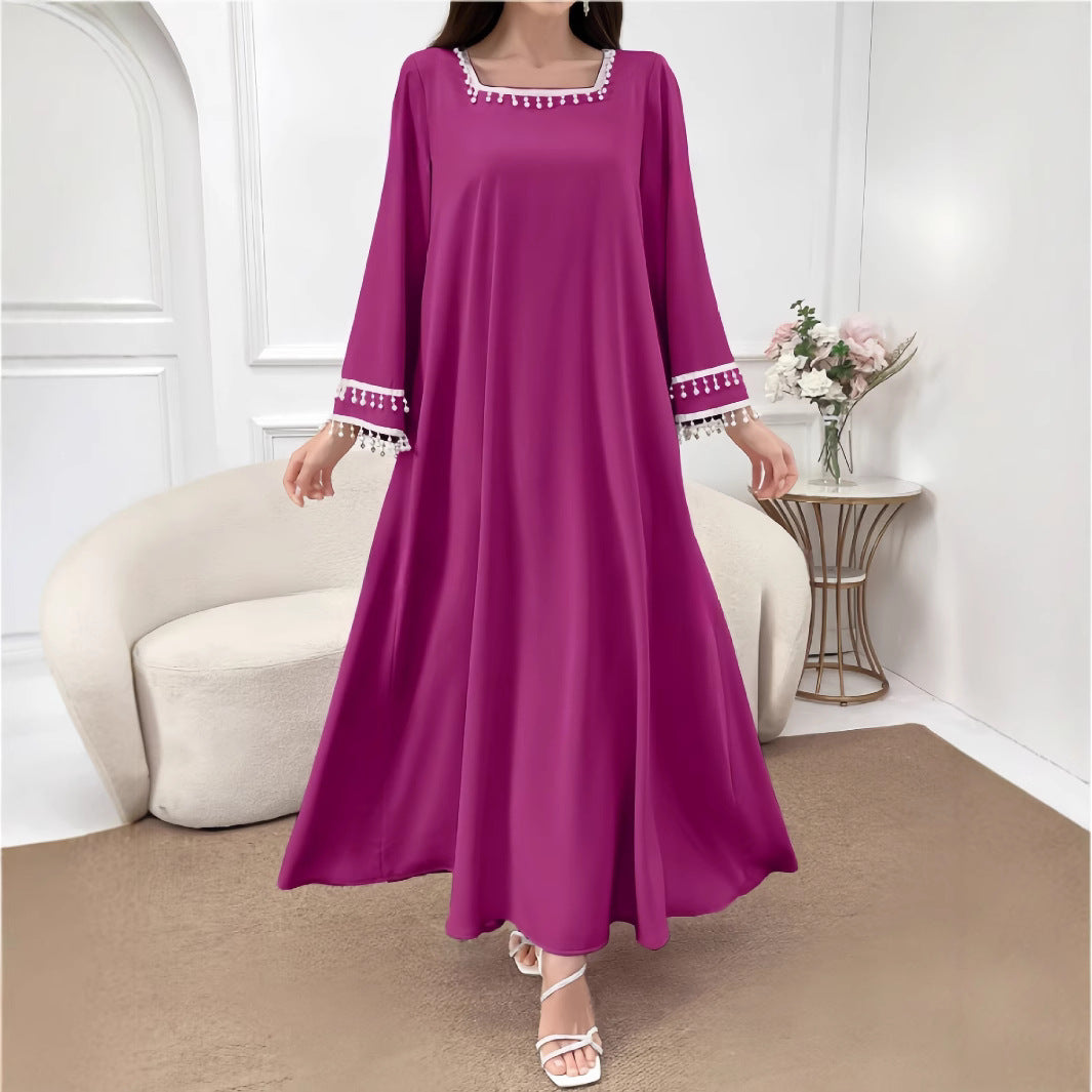 Kvindelige elegante maxi kjoler med dekorative franje og brede ærmer